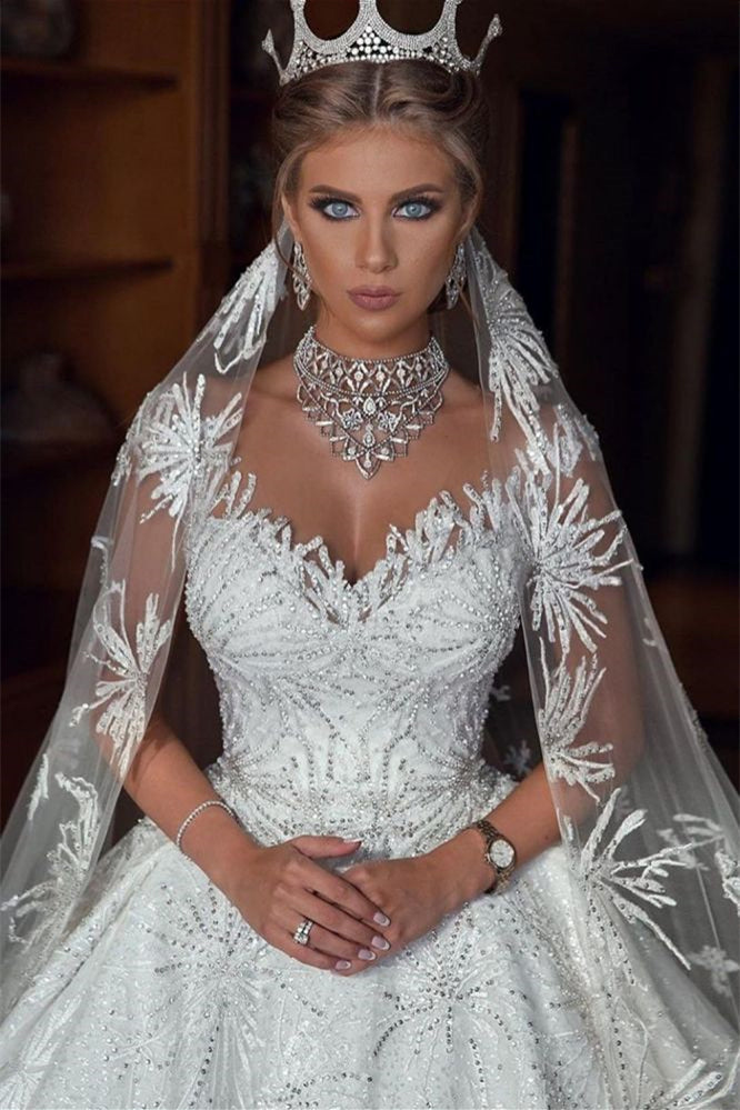 Glamouröses Ballkleid-Brautkleid mit Flügelärmeln und Perlenverzierung