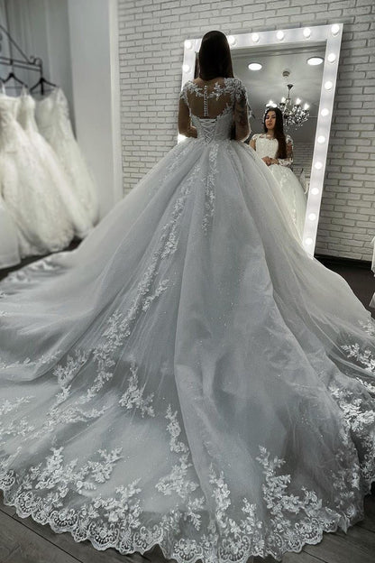 Ballkleid-Hochzeitskleid aus transparentem Tüll mit langen Ärmeln und Applikationen