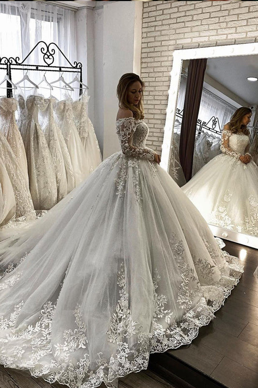Schulterfreies Illusions-Ballkleid-Hochzeitskleid mit langen Ärmeln und Applikationen